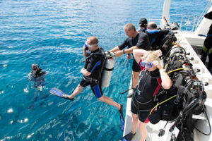 Diver jumping off boat at Catalina Island